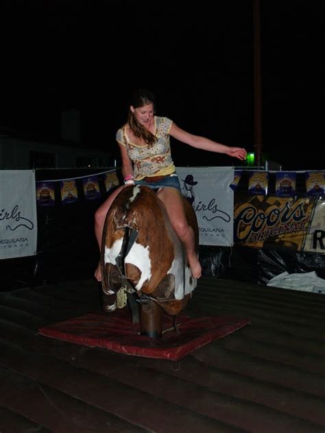 Mechanical bull riding hottie flashes her panties